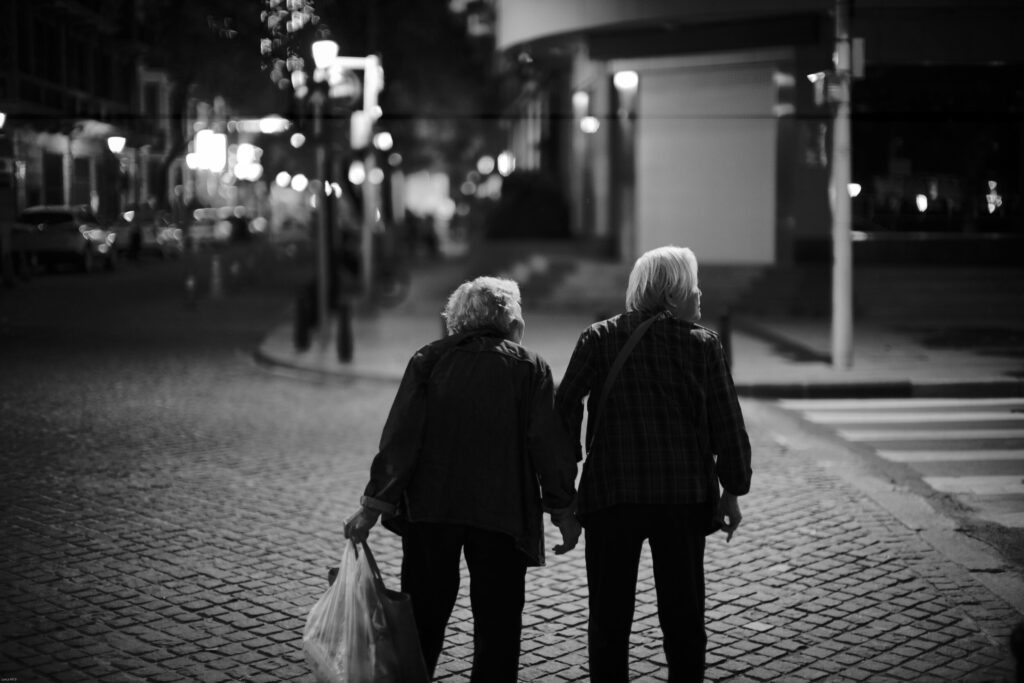 Old couple walking down the street